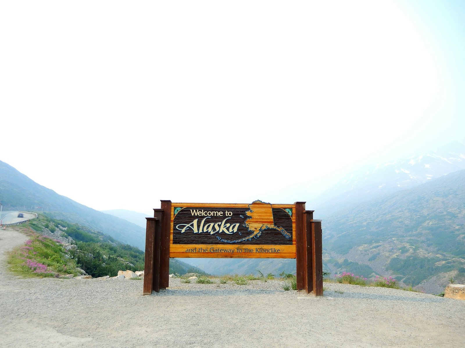 A brown wooden signage showcasing Alaskan culture