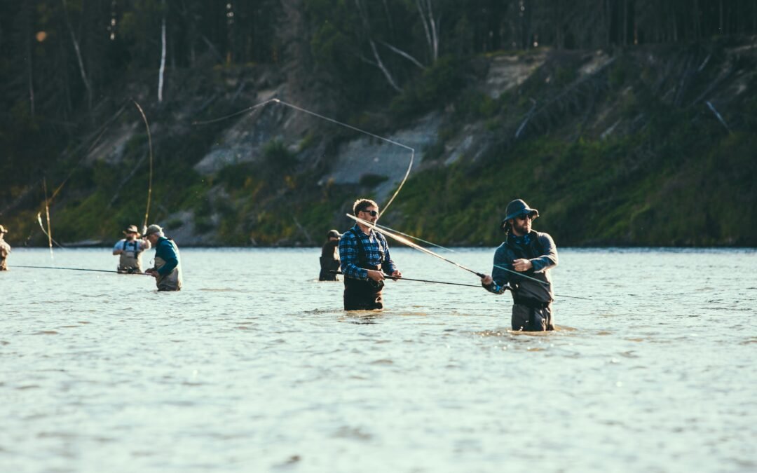 People on a boat fishing on a lake during the day